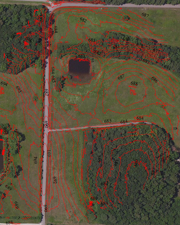 Aerial view of rural land with elevation contours showing slopes and low areas