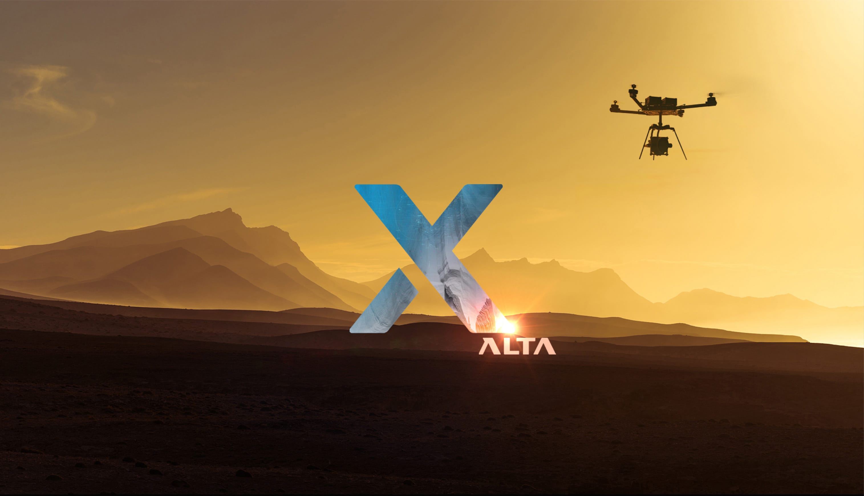 Freefly Alta X flying over a golden mountain landscape at sunset, with the Alta X mark