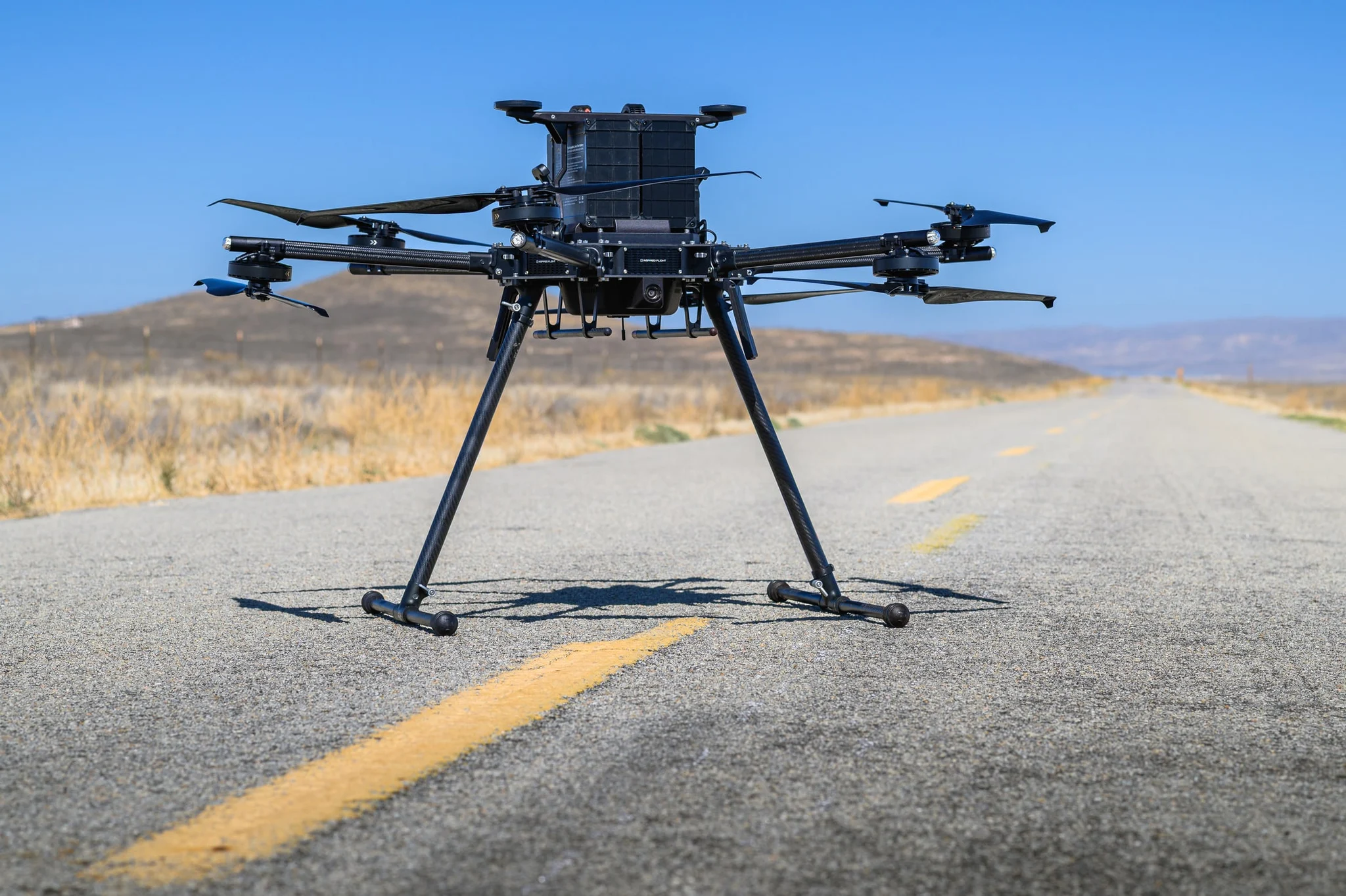 Inspired Flight IF1200 heavy-lift hexacopter positioned on a roadway